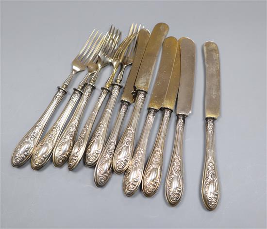 A set of five 800 standard handled fruit forks and six matching knives.